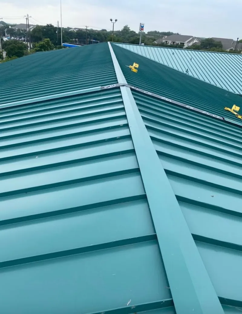 Green commercial metal roof ridge and valley for Metal Roof Repair in Austin